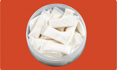 Velo nicotine pouches on orange background